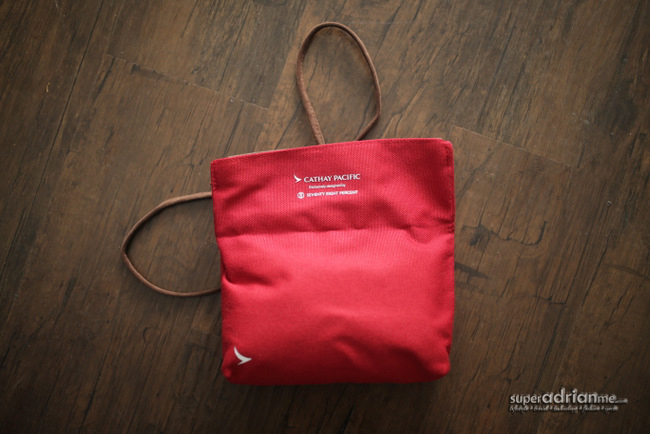 The amenity kit opens up to reveal both the logos of Cathay Pacific and Seventy Eight Percent