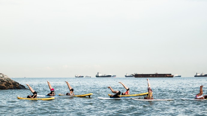 Stand Up Paddle Yoga by SUP Yoga is one of the many activities KFIT offers.