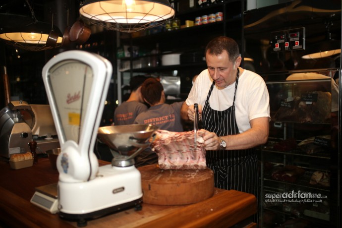 A butcher’s block where Chef sawis off cuts from large chunks of beef at District 10 @ Suntec