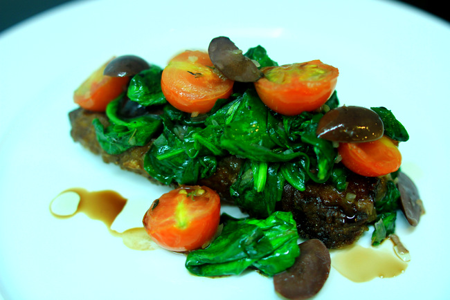 Delicious and succulent Grilled Sirloin Steak with Buttered Spinach, Tomatoes, Black Olive and Basil Cream Hollandaise.