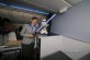 ANA flight attendant with a light sabre and a miniature Storm Trooper