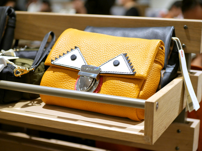 The flagship store boasts an wide selection of accessories, including bags, clutches and scarves for women.