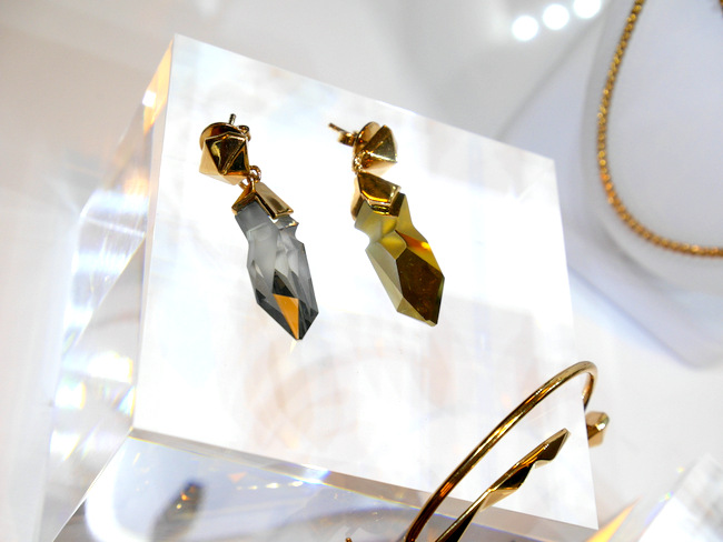 The Jean Paul Gaultier Reverse collection showcases his unique Kaputt crystal in reversible asymmetrical sides. Pictured here is a pair of Reverse Earrings.