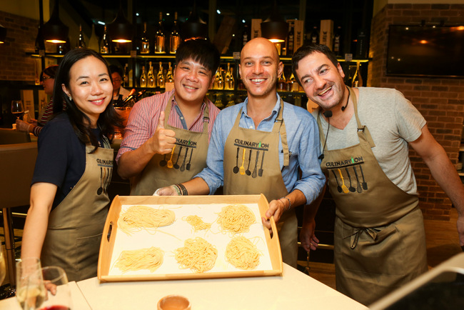 Proud faces as they succeed at their very first attempt at pasta making.