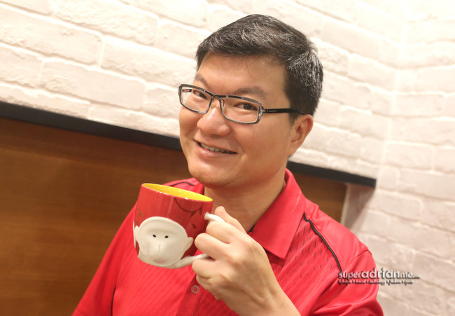 Adrian and his favourite mug from Starbuck's Chinese New Year 2016 Collection.