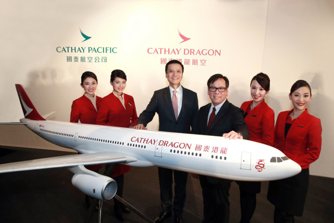 Cathay Pacific Chief Executive Ivan Chu (third from left) and Dragonair Chief Executive Officer Algernon Yau (fourth from left) unveiled the new Cathay Dragon livery