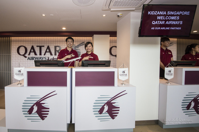 KidZania Singapore Ticketing Counters in Qatar Airways branding