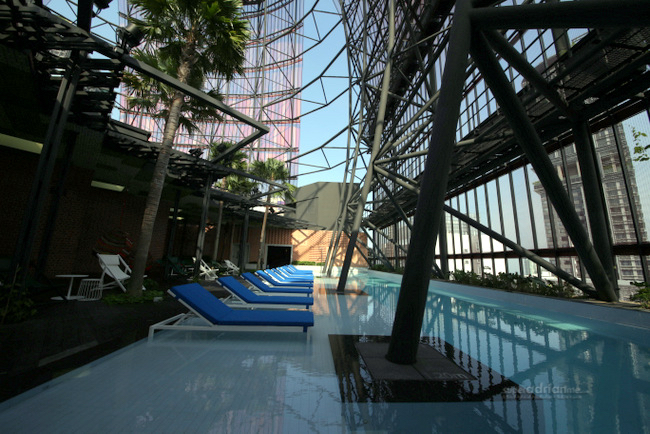 Stay at Oasia Hotel Downtown Singapore and swim at the roof top.