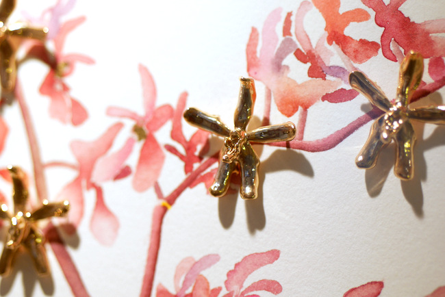 RISIS gold plated orchid blooms presented in collaboration with local watercolour artist, Lucinda Law.