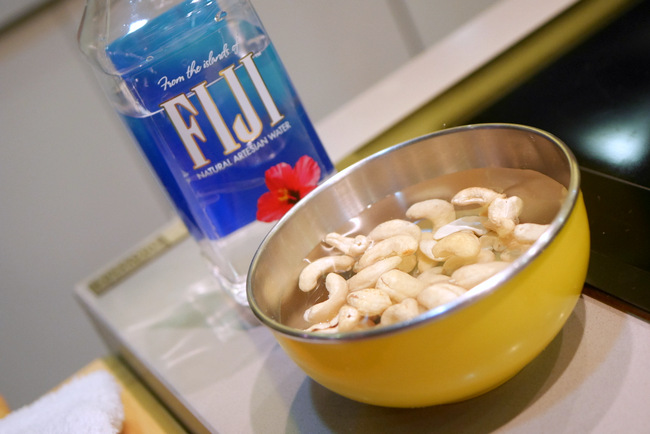 Chef Jo Ann soaks the cashews in FIJI Water. This will soften them before blending, and the FIJI water will maintain its natural taste.
