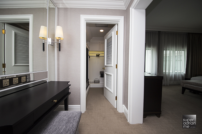 The Ritz Carlton Kuala Lumpur Suite bedroom with walk in closet and dressing table