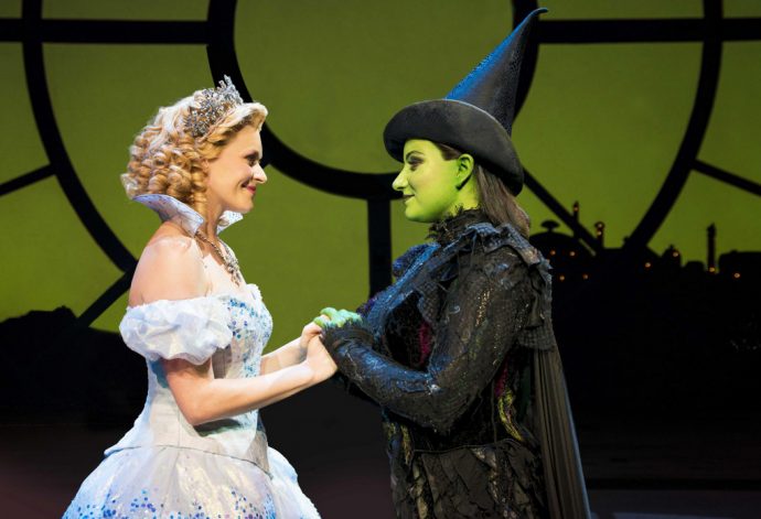 Carley Anderson as Glinda and Jacqueline Hughes as Elphaba in Wicked. (Credit: Wicked)