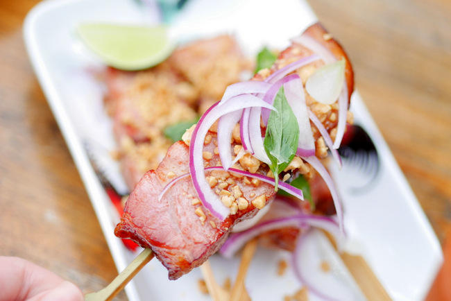 Loof's Bacon Lollipop (S$16): pancetta nuggets glazed with maple syrup, groundnuts and pho herbs.