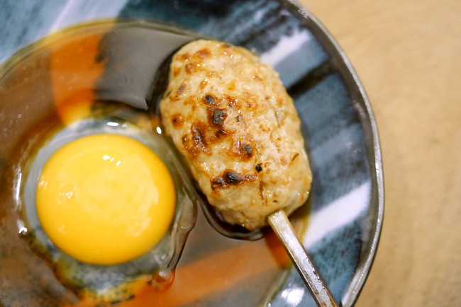 Kurama Robatayaki Tsukune (S$8), served with a raw egg.