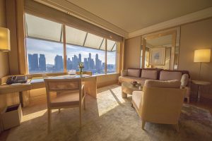 The Ritz-Carlton Millenia Singapore Premier Suite living room with a view of the Singapore Skyline