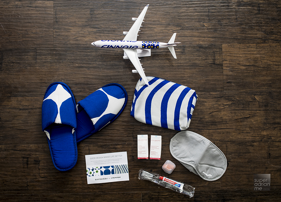Marimekko-design slippers and amenity kit with Clarins skincare products 