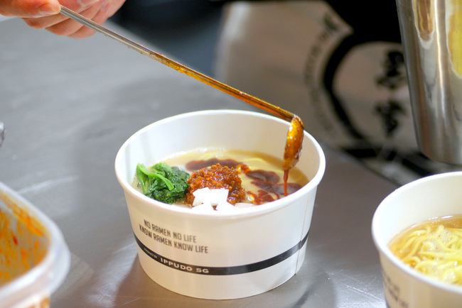KURO-OBI offers up Yokohama ramen noodles in a rich Tori-paiten (100% chicken broth) for takeaways at Marina Bay Sands. Pictured here is the AKA-OBI (S$10) with lightly spiced shrimp-based miso.