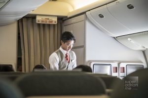 Cathay Pacific Flight Attendant in Business Class