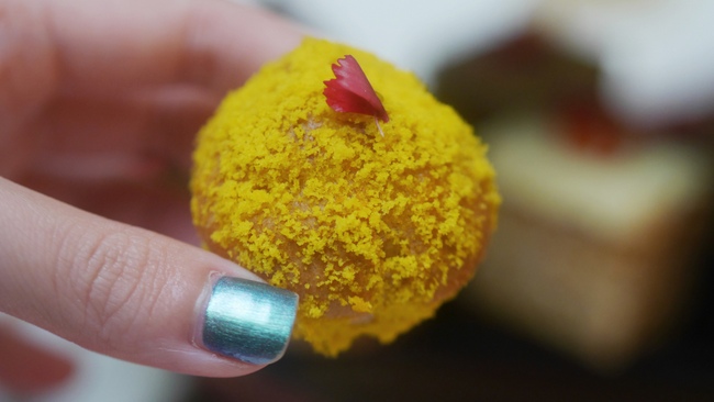 Fullerton Hotel's International Women's Day Afternoon Tea includes seven savouries and eight sweets. Pictured here is the Mango Profiteroles.