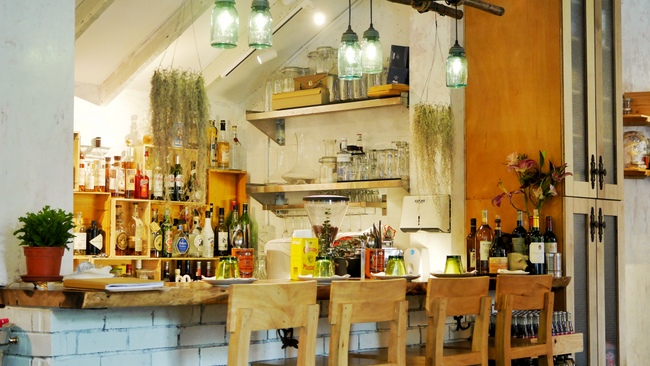 Morsels by Chef Petrina Loh at Dempsey presents a rustic, barnyard interior.