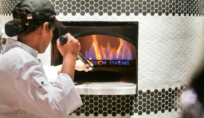 JW Marriott Singapore South Beach introduces Beach Road Kitchen, its all-new, all-day buffet venue. Pictured here is the Pizza Oven, bringing out a rotation of pizzas. This includes the signature truffle pizza.