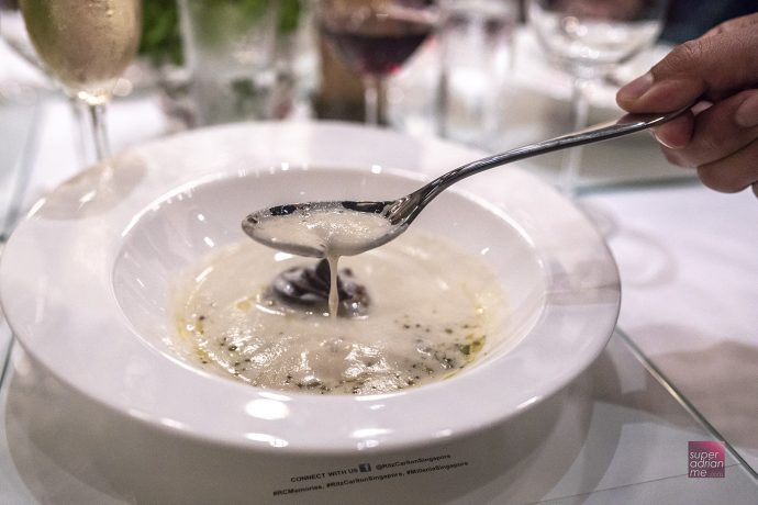 Drinking soup with a cleft spoon.