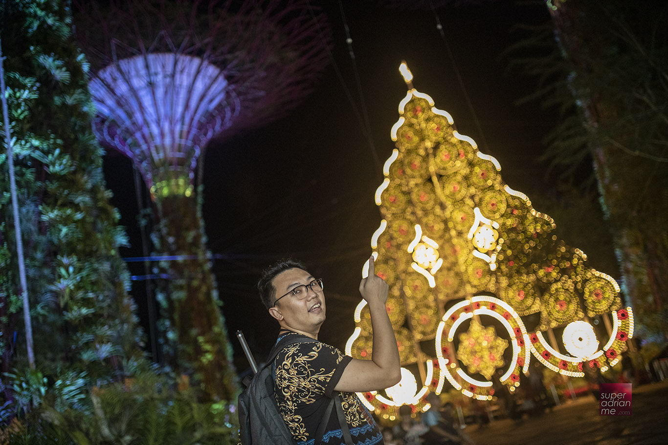 Asia's tallest luminaries Christmas tree illuminated in gold at the entrance of Gardens by the Bay.