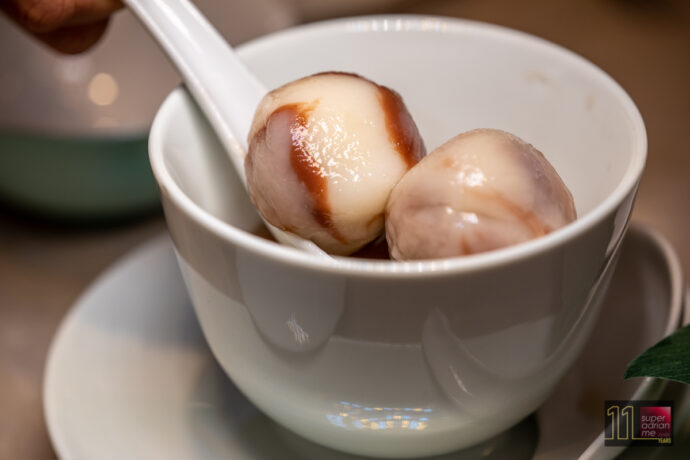 Yi by Jereme Leung - Glutinous rice dumplings stuffed with candied winter melon & red bean paste in brown sugar ginger tea.