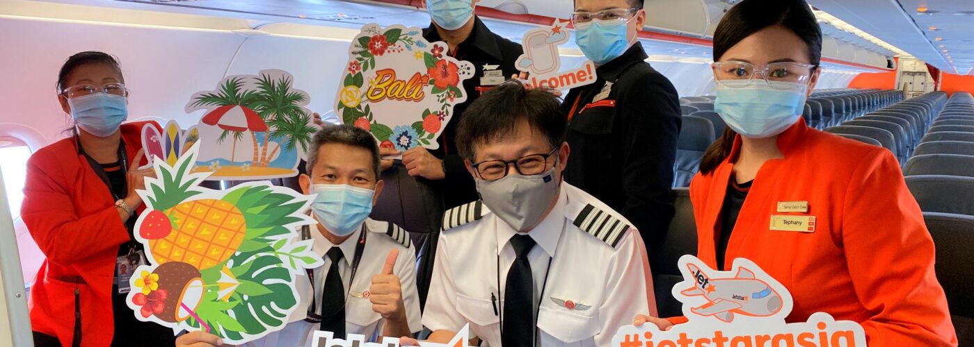 Crew preparing to welcome passengers on board the first Bali flight in more than two years. (Jetstar Asia photo)