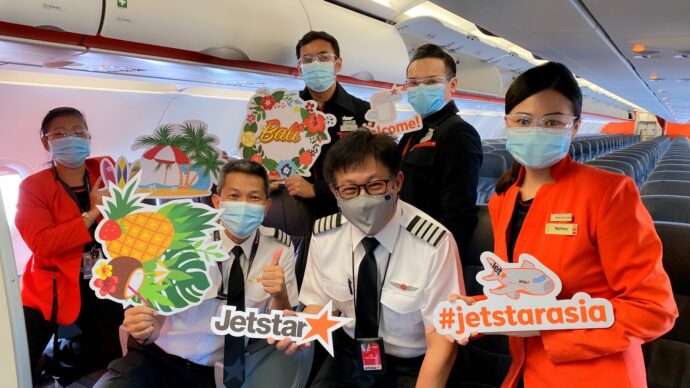 Crew preparing to welcome passengers on board the first Bali flight in more than two years. (Jetstar Asia photo)