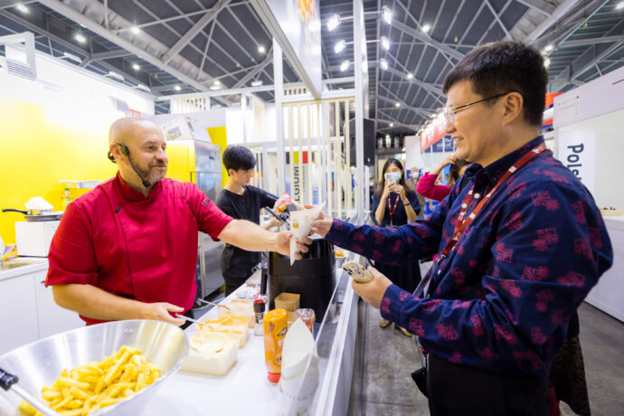  Belgian Chef, Bart Sablon, serving a cone of the Original Belgian Fries at the Food & Hotel Asia Singapore