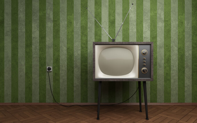 Old TV in empty room with green striped wallpapers (depositphotos.com)