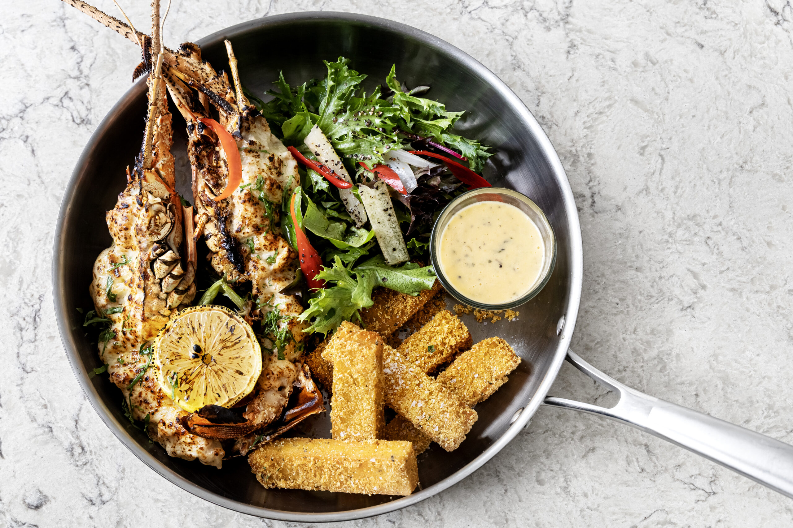 Bedrock Origin (Australian Rock Lobster Thermidor is served with crispy polenta fries, velvety béchamel sauce, and zesty béarnaise)