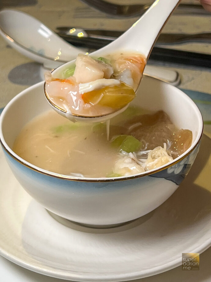 Double boiled superior seafood soup and mushroom served in Melon husk