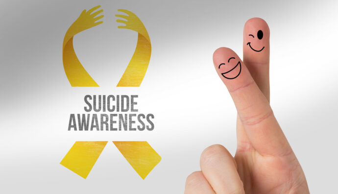 Fingers smiling against suicide awareness message (Depositphotos.com)