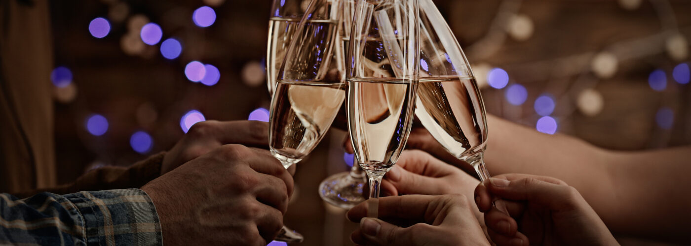 Clinking glasses of champagne in hands on bright lights background (Source: depositphotos.com)Clinking glasses of champagne in hands on bright lights background (Source: depositphotos.com)