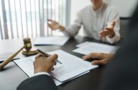 Concept of lawyer counseling, Businessman consults senior lawyer for advice on a business contract.