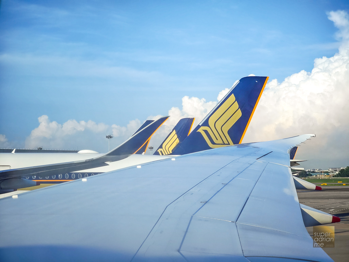 Scoot tail with Singapore Airlines tails at Changi Airport on 17 June ...