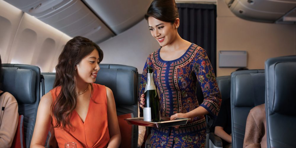 Premium Economy_Serving_Champagne