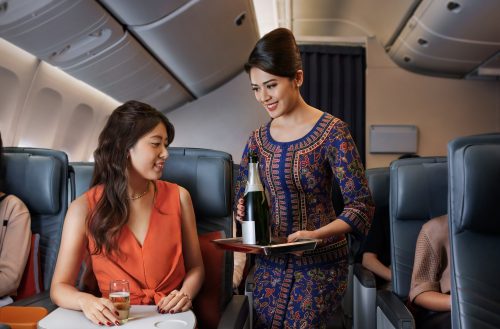 Premium Economy_Serving_Champagne