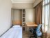 Smaller bedroom with two Murphy single beds in the Great World Residences 3 bedroom apartment