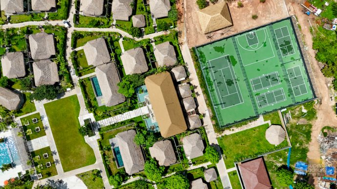 Drone shot of Tennis courts and Villas at JATI Koh Russey | SUPERADRIANME.com Drone shot of Tennis courts and Villas at JATI Koh Russey