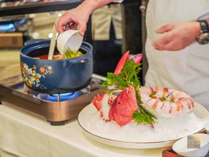 Wild Coral Trout Poached in Hot & Sour Tomato Broth served tableside (S per 100g)
