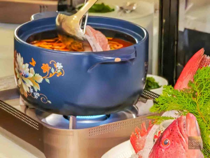 Wild Coral Trout Poached in Hot & Sour Tomato Broth served tableside (S per 100g)