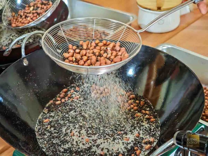 Cooking Peanuts in Salt and Red Oolong tea leaves at Bi Luo Yuan Tea House