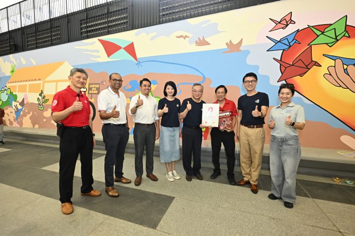 [From left to right] Mr Ronnie Tay, Deputy President (Administration) & Chief Financial Officer of SIT, Dr Janil Puthucheary, Senior Minister of State, Ministry of Education & Ministry of Sustainability and the Environment, Mr Ahmad Firdaus Daud, Second Adviser to Punggol GRC Grassroots Organisation, Ms Sun Xueling, Senior Minister of State for Transport of Singapore, Adviser to Punggol GRC Grassroots Organisations, Deputy Prime Minister, Minister for Trade and Industry, Adviser to Punggol GRC Grassroots Organisations, Mr Ong Eng Huat, President, Singapore Book of Records, Mr Baey Yam Keng, Mayor of North East District, Minister of State, Ministry of Transport, Ministry of Culture, Community and Youth, and Ms Jacqueline Poh, Chief Executive Officer, JTC Corporation, presented with the Singapore Book of Records certificate for the “Longest Handpainted Mural” in Singapore. (Northeast CDC photo)