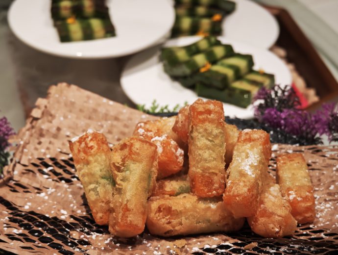Crystal Jade Golden Palace Golden Pumpkin Prosperity Glutinous Rice Nian Gao with Pistachio Coconut Water Chestnut Cake in background