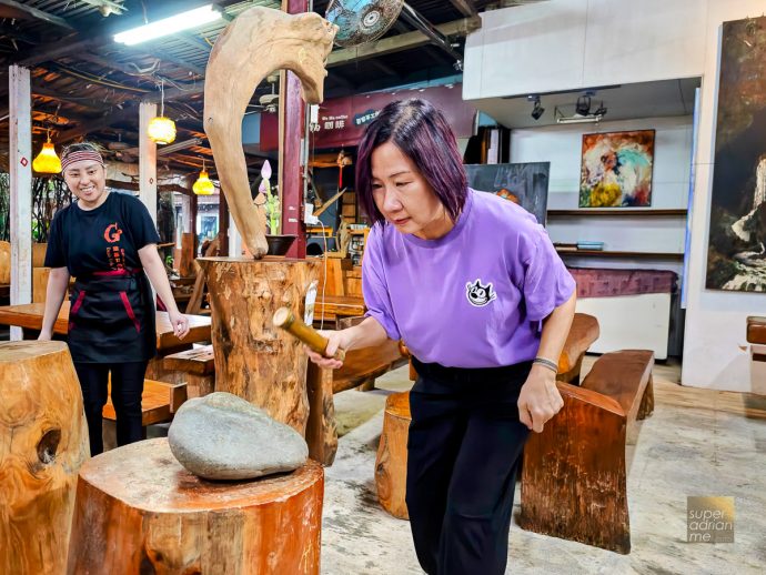 Dajili Tribal House in zXiulin Township Hualien - 21 July 2025 --2 | SUPERADRIANME.com Breaking the bamboo on a rock to eat the rice within
