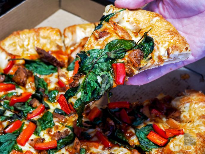 A slice of Pizza Hut Singapore Sichuan Roasted Chicken Pizza | SUPERADRIANME.com A slice of Pizza Hut Singapore Sichuan Roasted Chicken Pizza