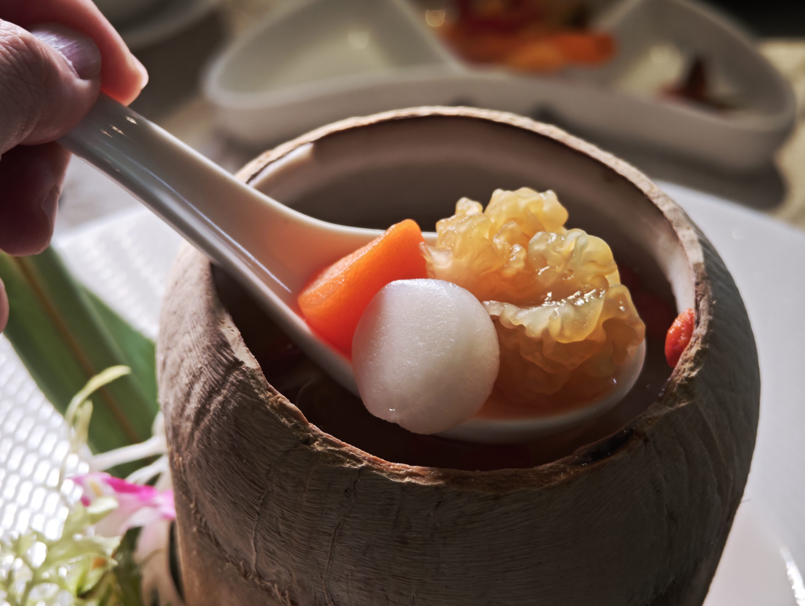 Double-boiled Organic Radish Soup with Golden Fungus served in Whole Coconut